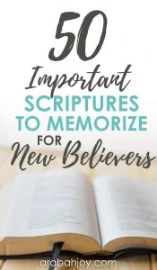 Open Bible on a table with an overlay that reads 50 important Scriptures to memorize for new believers