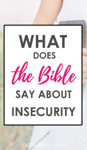 Bible sitting on table with hands folded on top of it and overlay that reads What does the Bible say about insecurity